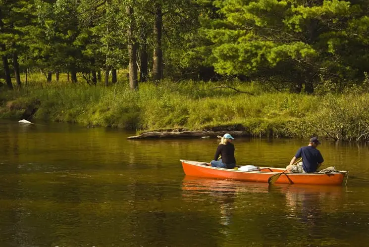 couple canoe water